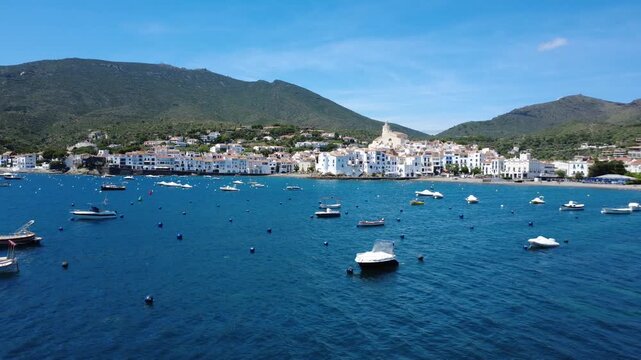 Aerial views of Cadaqu&eacute;s village and its iconic white church on the Costa Brava