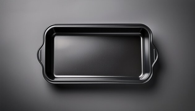 sleek black rectangular baking tray on smooth surface overhead view of a vacant foam food
