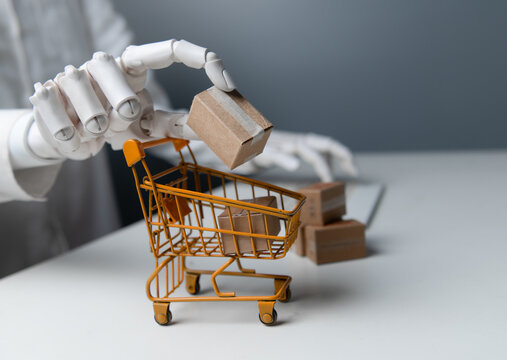Robotic Hand Putting Cardboard Package in Shopping Trolley with Keyboard Background