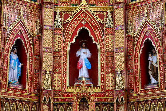 Ornate Catholic Altarpiece with Three Religious Statues