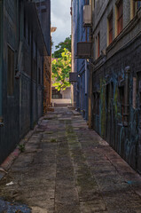 Fototapeta premium Narrow Alley Between Two Old Buildings.
