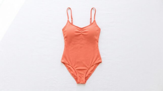 Coral Ribbed One Piece Swimsuit with Ruched Bodice and Adjustable Straps Laid Flat on White Background