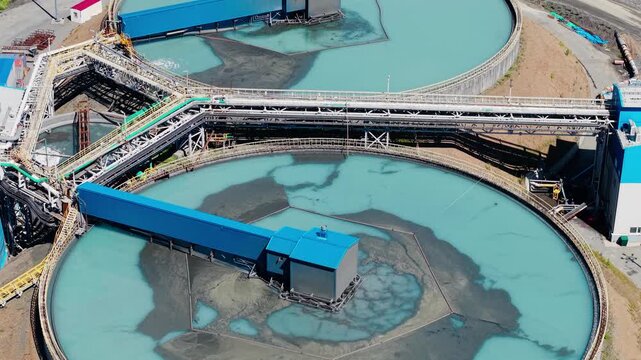 Industrial filtration water and treatment facility with sedimentation tanks pulp in gold, copper mining industry. Aerial view manufacturing infrastructure of concentrate factory.