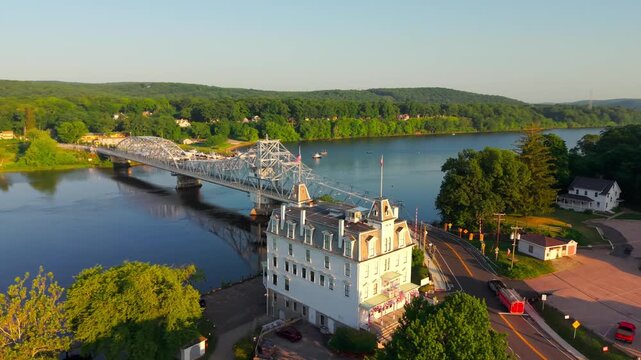 Summer aerial view featuring the East Haddam Swing Bridge and the Goodspeed Opera House in East Haddam, Connecticut just after sunrise