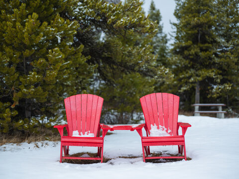 Two iconic red chairs in Canada under the snow 
