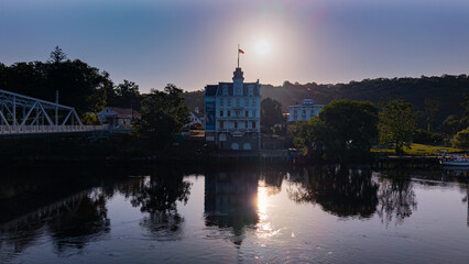 Naklejka premium Summer aerial view of the Goodspeed Opera House in East Haddam, Connecticut just after the sun rise