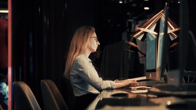 Programmer Working On Computer In Dark Office Late Night. Software Developer. Overtime