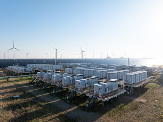 wind power station with battery storage containers and solar panels © zhu difeng