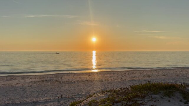 Gorgeous sunset on the beach over the Gulf of Mexico at Casey Key in Sarasota, Florida.	