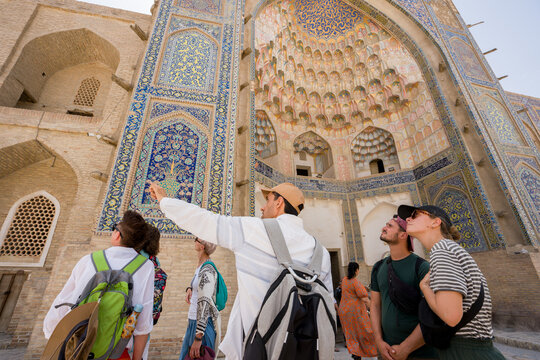 Tourists Explore Abdulaziz Khan Madrasah With A Guide