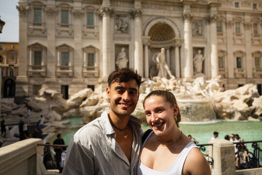 Couple posing at the Trevi Fountain