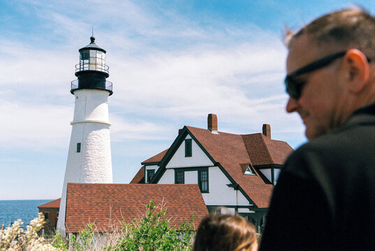 Family on vacation visits historic lighthouse in Maine