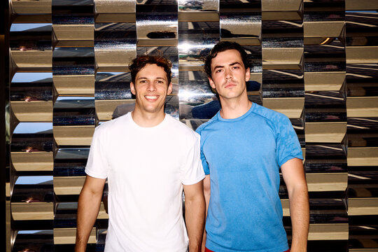 Athletes Stand Together in Sportswear With a Shiny Background