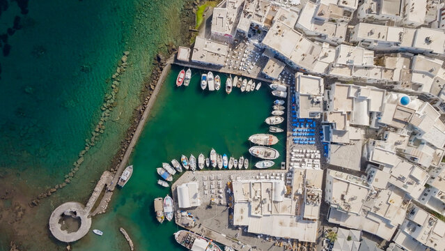 Naoussa Paros harbor with fishing boats and white buildings