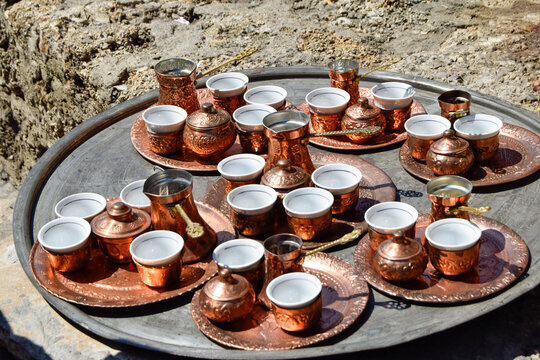 Traditional Copper Coffee Serving Sets Arranged on Large Tray