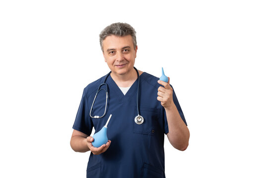 Small enemas held by a middle-aged male doctor against a white background.