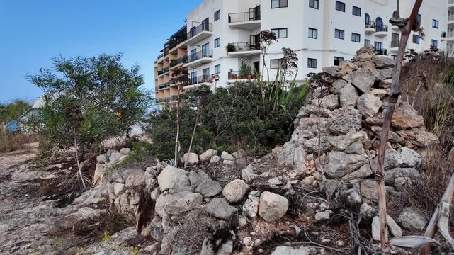 Ancient Cart Ruts on Xemxija heritage trail, parallel cartways groves cut into bare rock.
