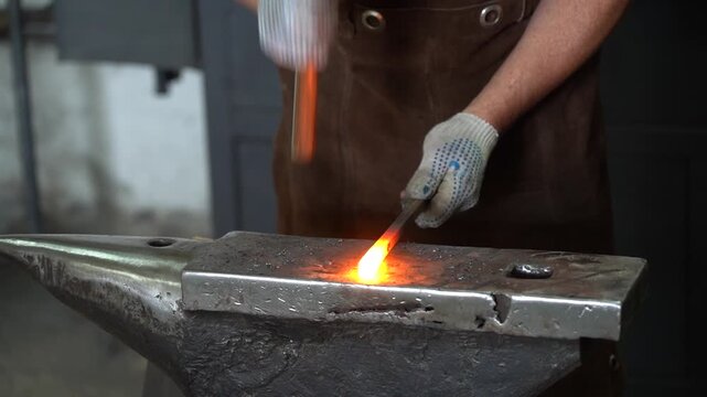 Crafting Hot Metal: An Artisan Blacksmith Shapes Iron with Precision and Skill in a Traditional Forge Environment