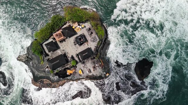 Drone footage of Pura Batu Bolong and Tanah Lot during