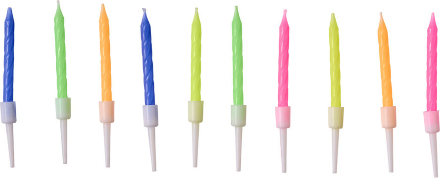 set of colorful unlit birthday candles isolated white background, wax party decorations with plastic holders in various bright colors