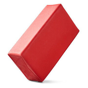 red rectangular rubber eraser isolated white background, blank stationery supply and school equipment, side view in macro close-up