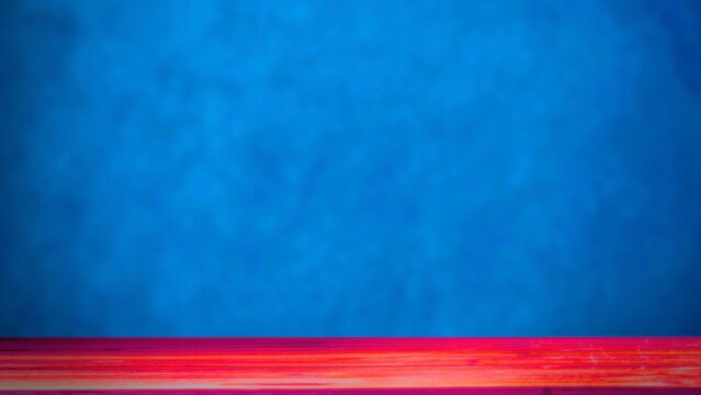 Abstract red wooden floor surface against vibrant blue textured wall background