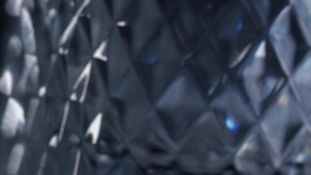 Abstract dark geometric pattern background with real light effects and subtle reflections, creating a modern and luxurious texture. This versatile design element is commercial use, advertising, and