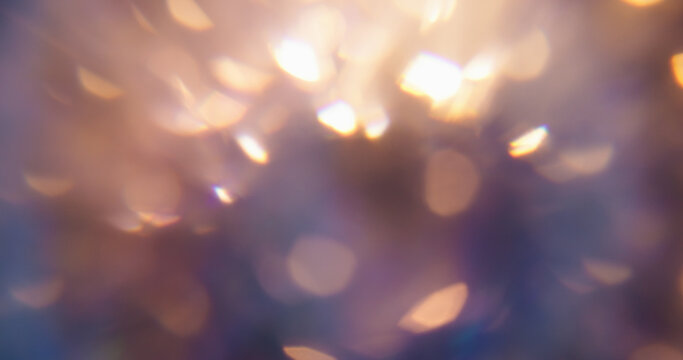 Blur kaleidoscope flare. Light abstraction. Purple neon orange colorful optical gleam circle on luminous bokeh glisten art background.
