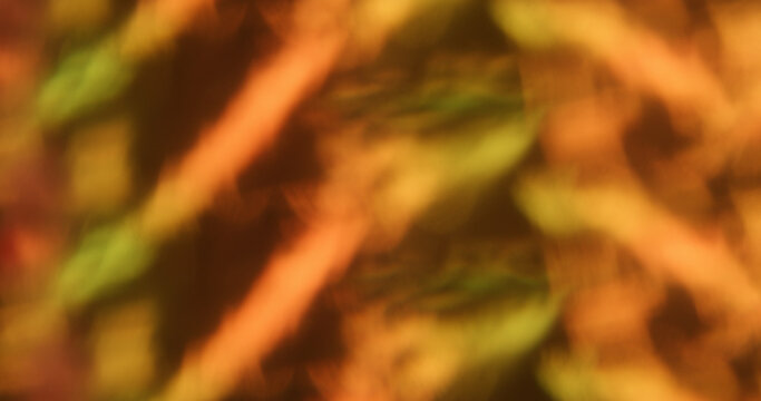 Blur optical gleam. Abstract orange flare. Vibrant pink yellow color lens shiny rainbow on glisten flash radiant bokeh light luminous background.
