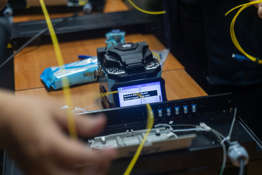 technicians working on fiber optic network setup