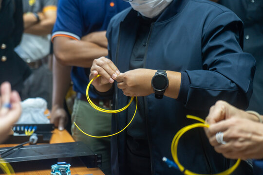 People Demonstrating Fiber Optic Cable Installation