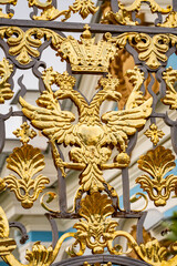 Fototapeta premium The coat of arms of the Russian Empire on the fence of the Catherine Palace. Tsarskoye Selo. Pushkin. 18th century