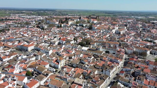 Aerial view of the historic center of &Eacute;vora, Portugal, a UNESCO World Heritage Site. Cinematic drone footage showcasing medieval streets, iconic monuments, and the city's timeless architecture.