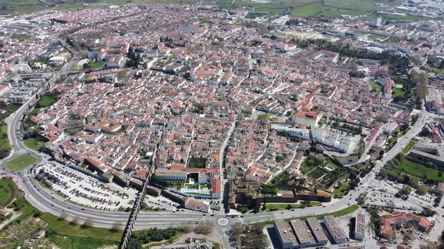 Aerial view of the historic center of &Eacute;vora, Portugal, a UNESCO World Heritage Site. Cinematic drone footage showcasing medieval streets, iconic monuments, and the city's timeless architecture.