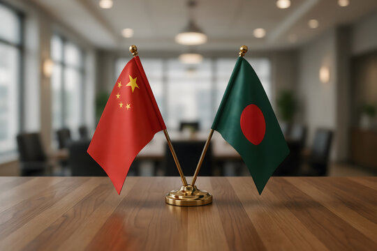 Crossed miniature flags of china and bangladesh on a wooden desk in a blurred office conference room for international diplomacy concepts
