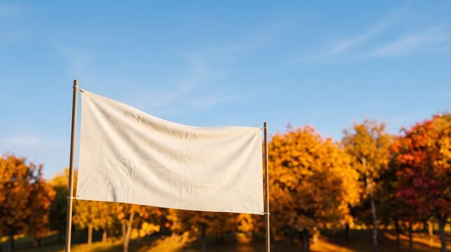 Eye-level shot of a blank white banner representing new opportunities with copy space in an autumn park.
