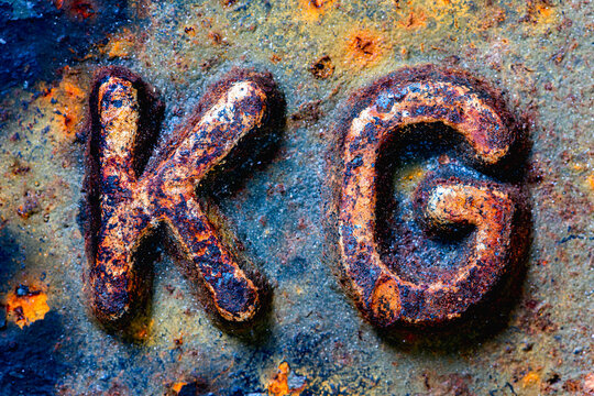 Steel KG Weight Symbol on an Old Cast Iron Weight, Concept of Mass and Heaviness