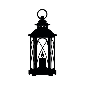 Black silhouette of a decorative lantern with a lit candle inside