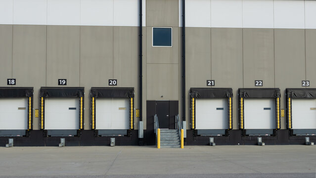 Industrial warehouse loading dock with numbered bay doors