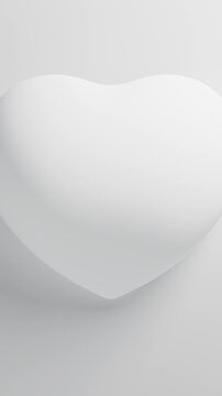 White heart pulsating on a white background, Valentine s Day 3D loop animation. Vertical video.