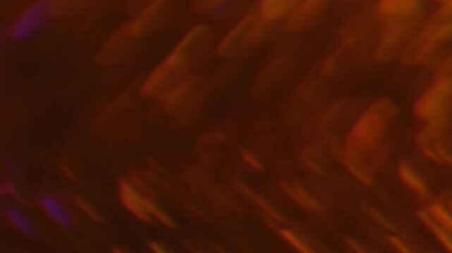 Sparkling glare art. Blur gleam. Duplicated lens flare prism stroboscopic bokeh rotation. Shiny color light leak orange violet abstract background.