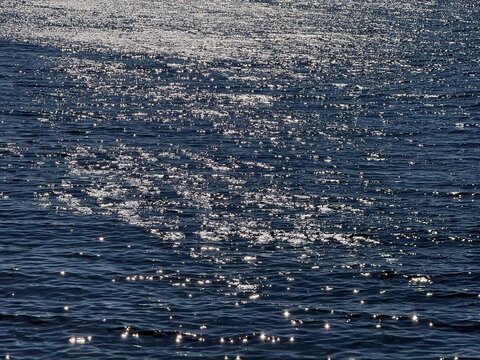 Glittering dark blue sea surface 