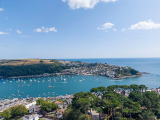 Fototapeta premium Aerial views of a coastal town, holiday campsite, marina, harbour, beach and surrounding countryside