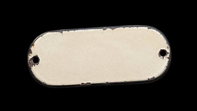 Worn blank metal nameplate isolated on black background