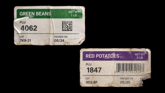 Worn produce price labels for green beans and red potatoes