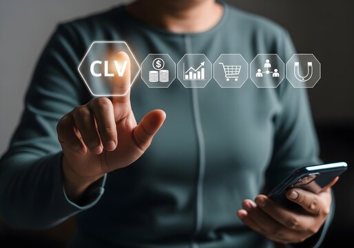 Marketing manager using a mobile device to analyze customer lifetime value metrics data