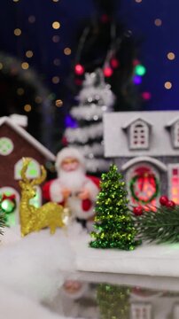A decorated Christmas town with a quirky Santa Claus in the foreground