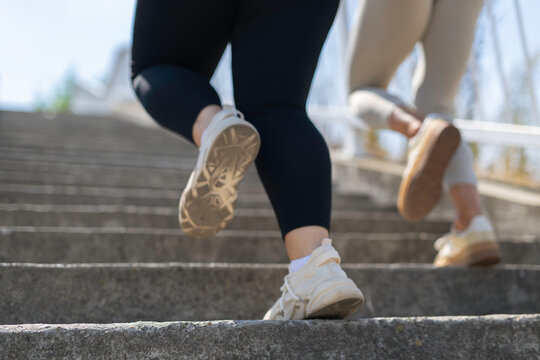 People running up stairs during outdoor workout