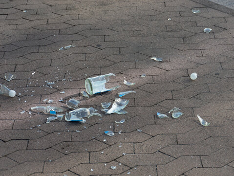Shattered Glass on Paved Surface Causing Hazard