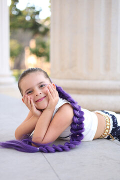 The little girl dressed in the costume of the K-pop character Rumi